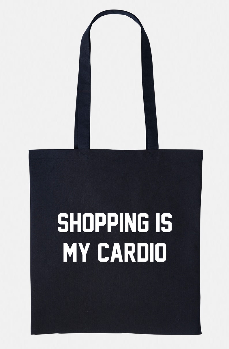May include: A black tote bag with white text that reads "SHOPPING IS MY CARDIO".