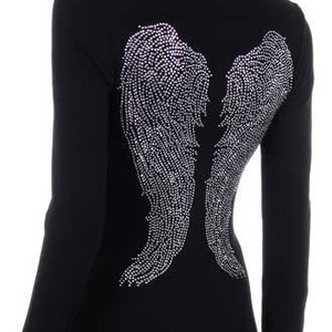May include: Black long-sleeved shirt with a rhinestone design of angel wings on the back.