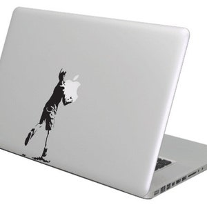 Apple boy Banksy MacBook decal sticker, fits all sizes.