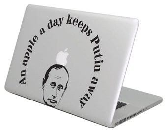 An apple a day keeps Putin away MacBook decal sticker, choose your size.