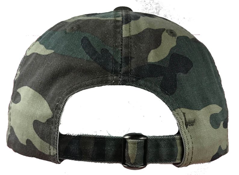 May include: A camouflage baseball cap with a black adjustable strap and buckle. The cap is made of a soft, cotton fabric.