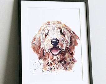 May include: Watercolor painting of a Goldendoodle dog in a black frame. The dog has brown fur, a black nose, and a pink tongue. The artwork is a portrait with a white background and watercolor paint splatters.