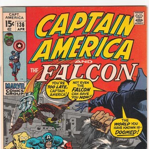 May include: Vintage Captain America comic book cover featuring Captain America and the Falcon. The cover is predominantly red with bold yellow and blue lettering. Comic book art depicts action scenes with various characters.