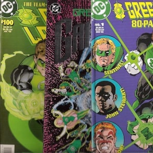 May include: Three Green Lantern comic books featuring vibrant green, purple, and black covers. The left cover shows issue #100, the center displays a dark textured graphic, and the right cover is an 80-page giant featuring portraits of Sentinel and John Stewart.