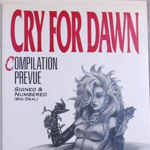 May include: A comic book cover titled CRY FOR DAWN COMPILATION PREVUE SIGNED & NUMBERED (BIG DEAL) featuring a black and white illustration of a character with voluminous hair, wearing gloves, holding a rose, and a knife with tears on their face.