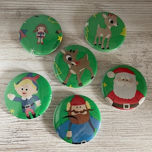 2.25&quot; Buttons Made with Repurposed Christmas Wrapping Paper Featuring Rudolph the Red Nosed Reindeer Gift Wrap Hermey Yukon Santa Clarice