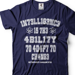 May include: Navy blue t-shirt with a white graphic print that reads "INTELLIGENCE IS THE ABILITY TO ADAPT TO CHANGE" and "STEPHEN HAWKING".