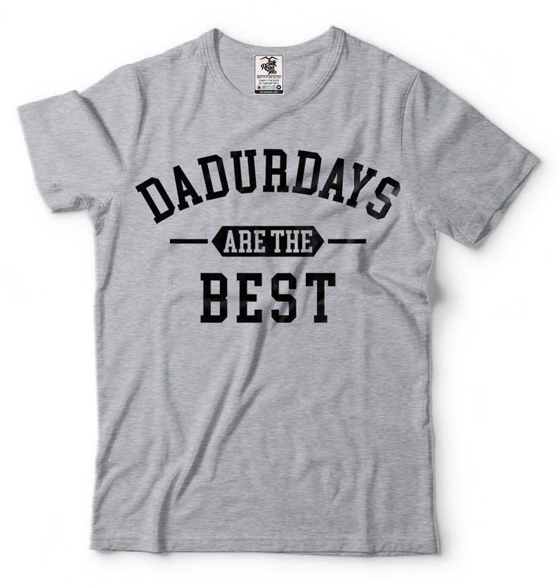 May include: Gray t-shirt with black text that reads "Dadurdays are the best".