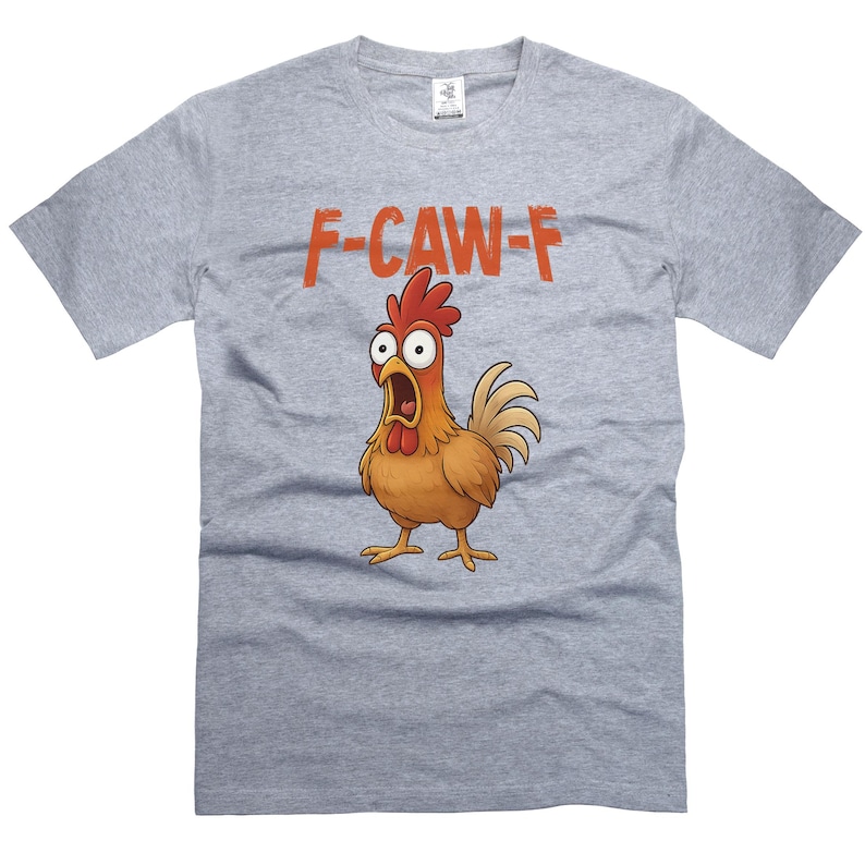 May include: A light gray t-shirt featuring a cartoon chicken with an open beak and wide eyes. Above the chicken is the text "F-CAW-F" in orange letters. The chicken is brown, red, and yellow.