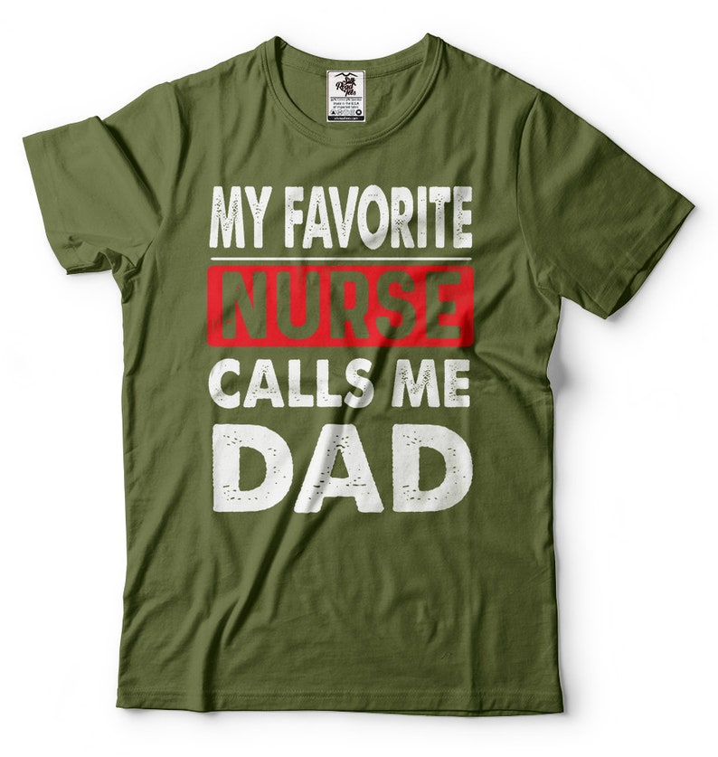 May include: Green t-shirt with white text that reads "My Favorite Nurse Calls Me Dad". The word "Nurse" is in red.