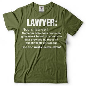 May include: Green t-shirt with a white graphic that says "LAWYER: Noun. [law-yer] Someone who does precision guesswork based on unreliable data provided by those of questionable knowledge See also Trouble-Solver, Wizard"
