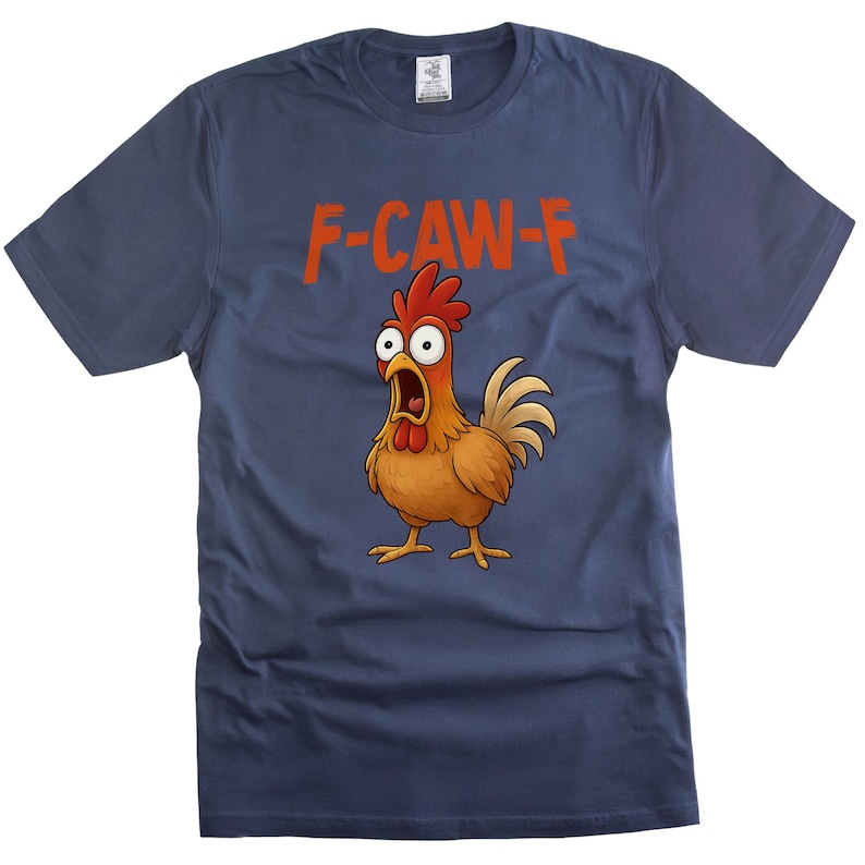 May include: Navy blue t-shirt featuring a cartoon chicken with an open beak and wide eyes. The text "F-CAW-F" is printed above the chicken in orange. The chicken is brown, orange, and tan with a red comb.
