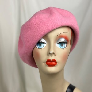 May include: A pink wool beret. The beret is soft and has a classic style.
