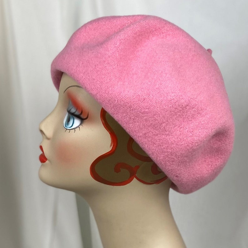 May include: A pink wool beret. The beret is soft and has a classic style.
