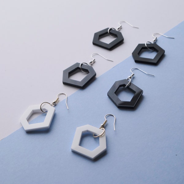 Set of modern, hexagon, acrylic drop earrings in black, grey and white.