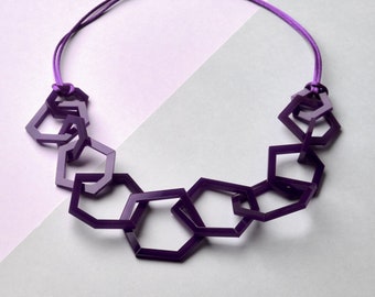 Purple chunky geometric acrylic statement necklace.