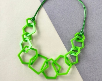 Lime green chunky geometric mid-length acrylic necklace.