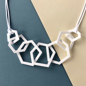 White stylish geometric mid-length acrylic necklace. image 5
