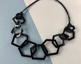 Black geometric mid-length chunky modern necklace.
