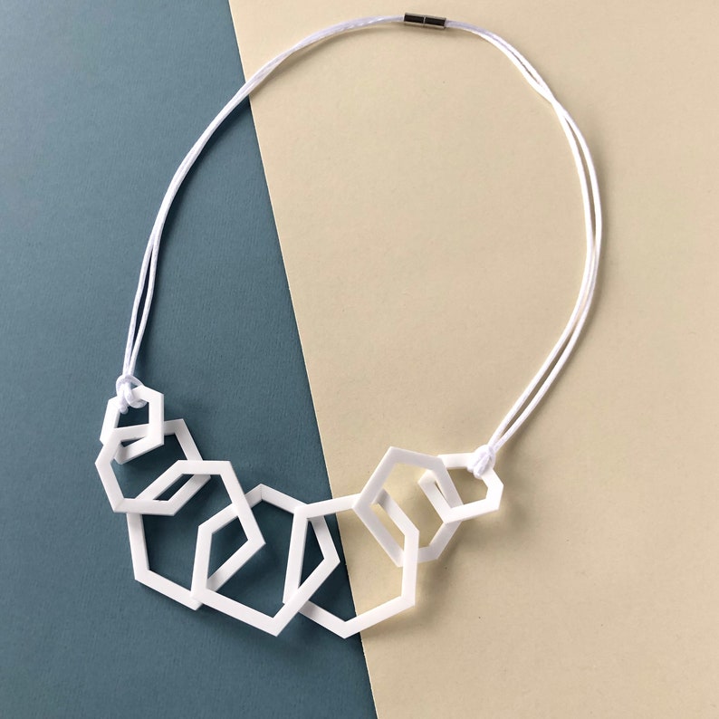 White stylish geometric mid-length acrylic necklace. image 3