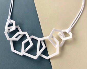 White stylish geometric mid-length acrylic necklace.