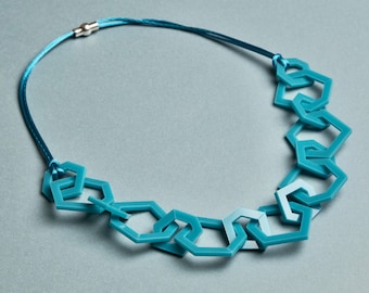 Turquoise modern geometric chain link acrylic necklace.