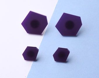 Set of large and small purple hexagon stud earrings.