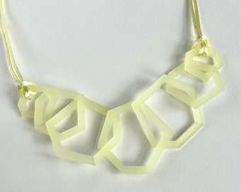 Pale yellow modern geometric acrylic necklace.