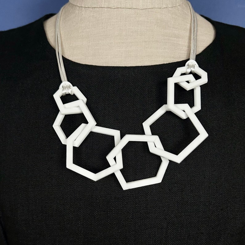 White stylish geometric mid-length acrylic necklace. image 2