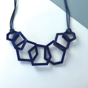 Modern navy blue mid-century geometric acrylic link necklace.