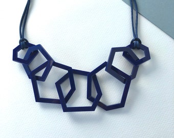 Modern navy blue mid-century geometric acrylic link necklace.