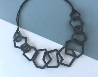 Modern charcoal grey geometric chunky mid-length necklace.