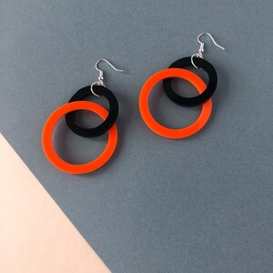 Orange and store black earrings