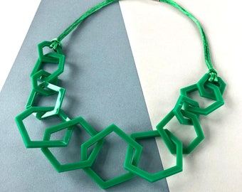 Emerald green chunky geometric acrylic mid-length necklace.