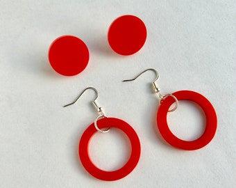 Set of bright red round stud and circle drop geometric acrylic earrings.