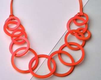 Bright orange chunky circle link modern statement necklace.