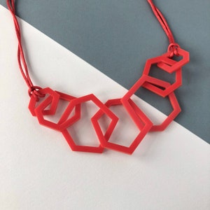 Bright red modern geometric acrylic necklace.