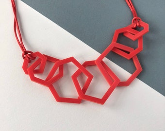 Bright red modern geometric acrylic necklace.