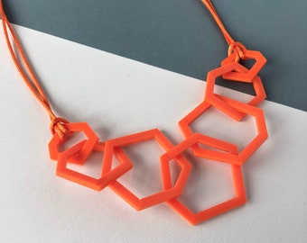 Bright orange modern geometric stylish acrylic necklace.