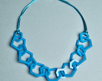 Sky blue modern geometric chain link acrylic necklace.