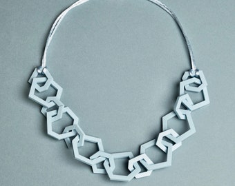 Pale blue modern geometric chain link acrylic necklace.