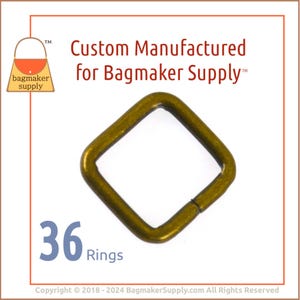 May include: A pack of 36 gold-colored metal rings, each ring is square shaped with rounded corners. The rings are designed for use in crafting and bag making.
