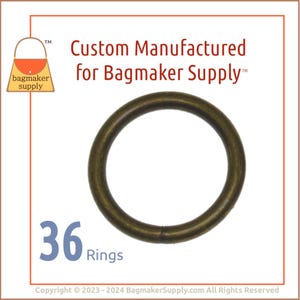 May include: A close-up of 36 brass rings. The rings are smooth and have a shiny finish. The rings are custom manufactured for Bagmaker Supply.
