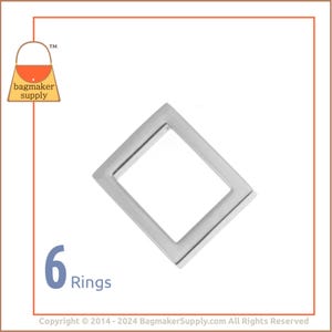 May include: Six silver metal rings, each shaped like a square with rounded corners. The rings are arranged in a row, with the text "6 Rings" below them.