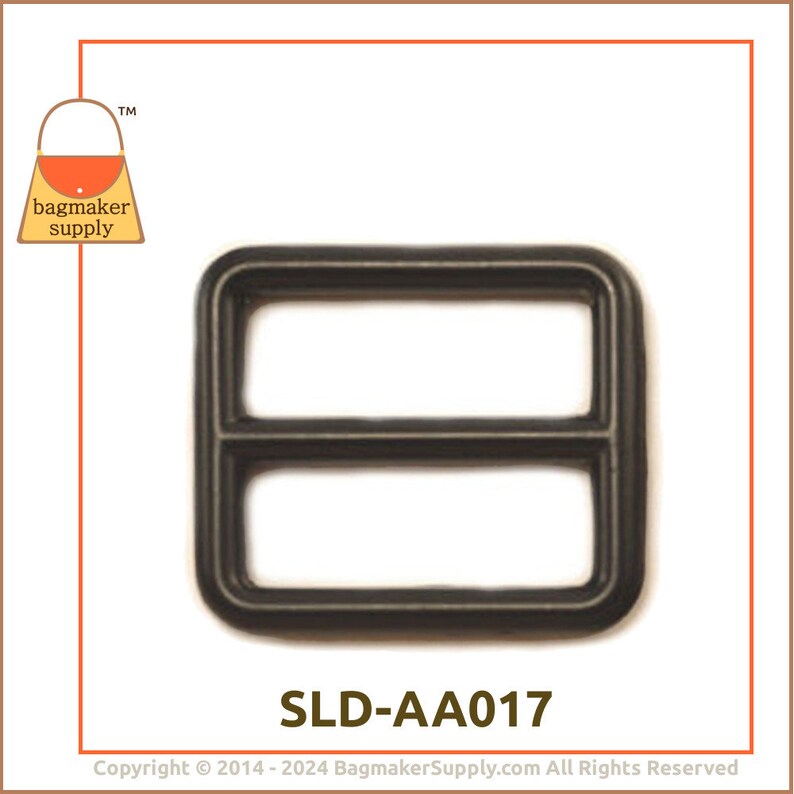 May include: A dark grey rectangular slider buckle with two parallel bars. The product code "SLD-AA017" is printed below the buckle. The "bagmaker supply" logo is in the upper left corner. Ideal for bag making.