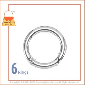 May include: Six silver metal rings, each with a spring-loaded clasp. The rings are approximately 1 inch in diameter.