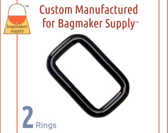 May include: Two black metal D-rings. The rings are approximately 1 inch in diameter. The image includes the text "Custom Manufactured for Bagmaker Supply™".