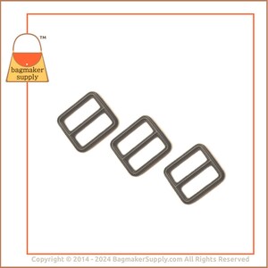 May include: Three dark grey metal rectangle sliders. Each slider has two parallel bars. The logo for bagmaker supply is in the upper left corner. The background is white.