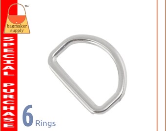 May include: Six silver metal D-rings. The rings are approximately 1 inch in diameter.
