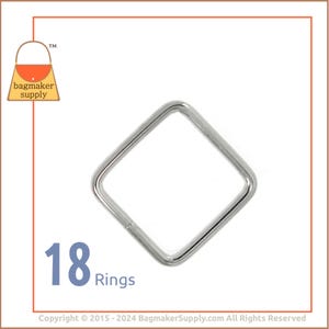 May include: A close-up of 18 silver square rings. The rings are about 1 inch in diameter.